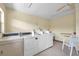 Shared laundry room with coin-operated machines at 2750 E Bay Dr # 15E, Largo, FL 33771