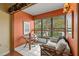 Relaxing sunroom with a comfy sofa and small table at 2750 E Bay Dr # 15E, Largo, FL 33771