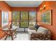 Bright sunroom boasts ample natural light and seating at 2750 E Bay Dr # 15E, Largo, FL 33771