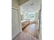 Main bathroom with double vanity and soaking tub at 295 Woodstream Way, Spring Hill, FL 34608