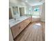 Bathroom with double vanity and a large soaking tub at 295 Woodstream Way, Spring Hill, FL 34608