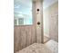 Elegant bathroom with a large walk-in shower, tile flooring, and modern fixtures at 295 Woodstream Way, Spring Hill, FL 34608