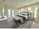 Bright bedroom with king-size bed and access to backyard at 295 Woodstream Way, Spring Hill, FL 34608