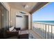 Oceanfront balcony with seating for relaxing at 3100 Gulf Blvd # 424, Belleair Beach, FL 33786