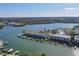 Stunning aerial view of waterfront condos with boat docks on a sunny day at 322 Windrush Blvd # 2, Indian Rocks Beach, FL 33785