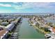 Expansive aerial view of waterfront homes with canals leading to the ocean at 322 Windrush Blvd # 2, Indian Rocks Beach, FL 33785
