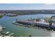 Aerial view of waterfront condos with boat docks on a sunny day at 322 Windrush Blvd # 2, Indian Rocks Beach, FL 33785