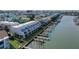 A row of waterfront townhomes with private docks and boat slips in a coastal community at 322 Windrush Blvd # 2, Indian Rocks Beach, FL 33785