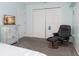 Inviting bedroom showcasing closet, dresser and accent chair, offering relaxation at 322 Windrush Blvd # 2, Indian Rocks Beach, FL 33785