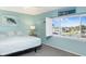 Bright bedroom with a coastal theme, featuring a water view and ample natural light at 322 Windrush Blvd # 2, Indian Rocks Beach, FL 33785