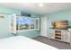 Bedroom with ample natural light and a view of the water at 322 Windrush Blvd # 2, Indian Rocks Beach, FL 33785