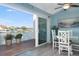 Cozy dining area featuring waterfront views and a beach-themed decor at 322 Windrush Blvd # 2, Indian Rocks Beach, FL 33785