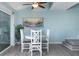 Dining area with beach decor and steps to another level at 322 Windrush Blvd # 2, Indian Rocks Beach, FL 33785
