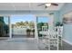 Cozy dining room features a waterfront view, seating for four, and an inviting atmosphere at 322 Windrush Blvd # 2, Indian Rocks Beach, FL 33785