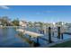 Waterfront dock with access to calm waters and nearby houses at 322 Windrush Blvd # 2, Indian Rocks Beach, FL 33785