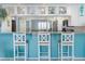 Stylish kitchen with counter seating and white cabinets providing both functionality and appeal at 322 Windrush Blvd # 2, Indian Rocks Beach, FL 33785
