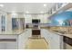 Bright and spacious kitchen featuring stainless steel appliances, island, and ample counter space at 322 Windrush Blvd # 2, Indian Rocks Beach, FL 33785