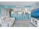 Open living area with updated kitchen, bright paint and water view at 322 Windrush Blvd # 2, Indian Rocks Beach, FL 33785