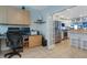 Dual office space open to a kitchen with stainless steel appliances and granite counters at 322 Windrush Blvd # 2, Indian Rocks Beach, FL 33785