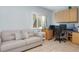 Comfortable home office with a work area and cozy couch at 322 Windrush Blvd # 2, Indian Rocks Beach, FL 33785