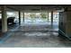Spacious covered parking area with waterfront view and convenient boat access at 322 Windrush Blvd # 2, Indian Rocks Beach, FL 33785