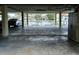 Spacious covered parking area with water views and extra storage at 322 Windrush Blvd # 2, Indian Rocks Beach, FL 33785