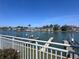 Water view from balcony featuring boat docks and a canal leading to the Gulf of Mexico at 322 Windrush Blvd # 2, Indian Rocks Beach, FL 33785