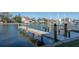 Canal with docks and boat lifts in a residential waterfront community at 322 Windrush Blvd # 2, Indian Rocks Beach, FL 33785