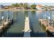 Waterfront property featuring a private dock, boat lift, and easy access to the open water at 322 Windrush Blvd # 2, Indian Rocks Beach, FL 33785