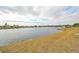 Expansive backyard overlooking the lake, offering stunning waterfront views and plenty of space for outdoor activities at 407 Blackhawk Cir, Sun City Center, FL 33573