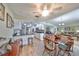 Open concept dining area with wood floors, classic decor, and views of the kitchen and living areas at 407 Blackhawk Cir, Sun City Center, FL 33573