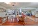 Open-concept dining space with an open view to the kitchen and living areas with tons of natural light at 407 Blackhawk Cir, Sun City Center, FL 33573