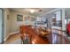 An open floorplan with a dining area, a view to the kitchen, and a bright living area at 407 Blackhawk Cir, Sun City Center, FL 33573
