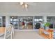 Covered patio featuring an inviting area with lake views and access to indoor living spaces at 407 Blackhawk Cir, Sun City Center, FL 33573