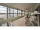 Relaxing sunroom with plenty of natural light and scenic views of the lake at 407 Blackhawk Cir, Sun City Center, FL 33573