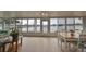 Bright sunroom with large windows offering beautiful lake views, perfect for relaxing or entertaining at 407 Blackhawk Cir, Sun City Center, FL 33573