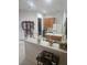 Kitchen with oak cabinets, an island, and a breakfast bar at 5125 Silver Charm Ter, Wesley Chapel, FL 33544