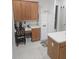 Bright kitchen with wood cabinets, island, and breakfast nook at 5125 Silver Charm Ter, Wesley Chapel, FL 33544