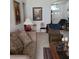 Living room features ample seating and decorative accents at 5125 Silver Charm Ter, Wesley Chapel, FL 33544