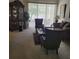Spacious living room with comfy seating and large window at 5125 Silver Charm Ter, Wesley Chapel, FL 33544