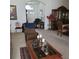 Elegant living room with a view into the dining area at 5125 Silver Charm Ter, Wesley Chapel, FL 33544