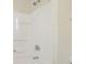 Clean bathroom with a tub and shower, featuring modern fixtures at 5308 Clewis Ave, Tampa, FL 33610