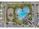 Community pool, playground, and parking lot at 5493 Blue Azure Dr, Wimauma, FL 33598