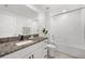 Clean bathroom with granite countertop and bathtub at 5493 Blue Azure Dr, Wimauma, FL 33598