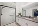 Modern bathroom with double vanity and walk-in shower at 5493 Blue Azure Dr, Wimauma, FL 33598