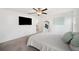 Spacious bedroom with large TV and ensuite bathroom at 5493 Blue Azure Dr, Wimauma, FL 33598
