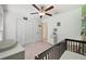 Bedroom with crib and built in shelving at 5493 Blue Azure Dr, Wimauma, FL 33598
