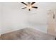 Charming bedroom with ceiling fan and double closet at 5493 Blue Azure Dr, Wimauma, FL 33598