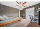 Spacious bedroom with ceiling fan and workspace at 5493 Blue Azure Dr, Wimauma, FL 33598