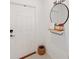 Bright entryway with a mirror, shelf, and basket at 5493 Blue Azure Dr, Wimauma, FL 33598